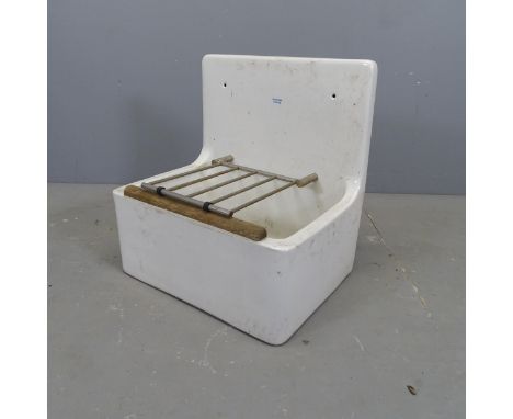 A glazed ceramic butler's sink with integrated drying rack, labelled Armitage Shanks. 52x54x39cm. 