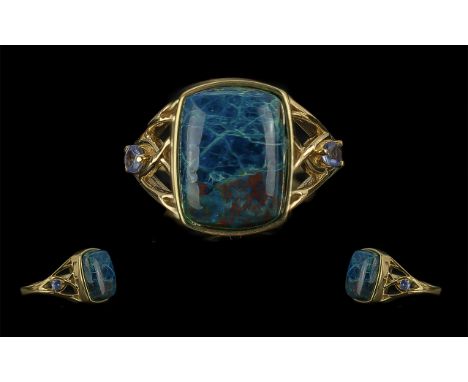 Shadowkite and Tanzanite Ring, an 8ct cushion cut cabochon of the swirled and mottled blue/turquoise/green stone, the colours