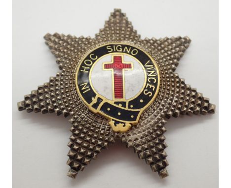 White metal and enamel seven pointed star with in HOC Signo Vines inscription 