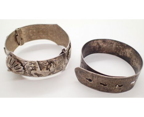 Hallmarked silver bangle and an Oriental white metal example 