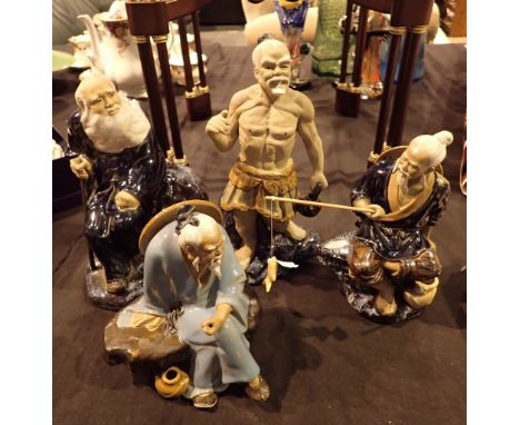 Four vintage Oriental Mudmen figurines 