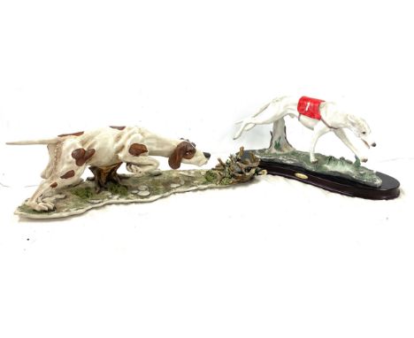 2 Large dog ornaments one Nao largest measures 17.5" long 5.5" tall 