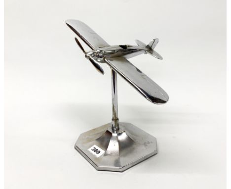 A vintage chromeplated model of a WWII aircraft, H. 28cm.