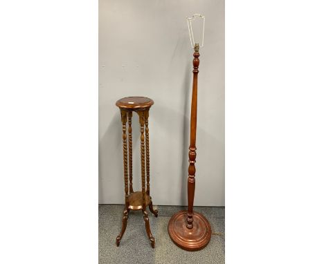 A mahogany plant stand, H. 102cm, with a turned mahogany standard lamp.