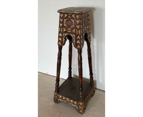 An antique Indian carved and bone inlaid hardwood torchere stand, 29 x 29 x 113cm.