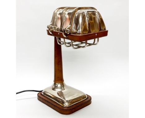 A contemporary metal and leather desk lamp, H. 37cm.