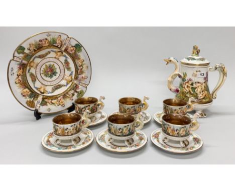 A Capodimonte coffee pot, six cups with saucers and fruit bowl, coffee pot H. 26cm.