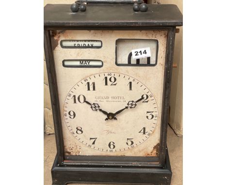 A battery operated reproduction metal hotel clock, H. 43cm.