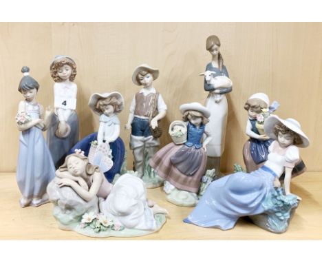 A group of seven Lladro and two Nao figures of girls, tallest H. 27cm.