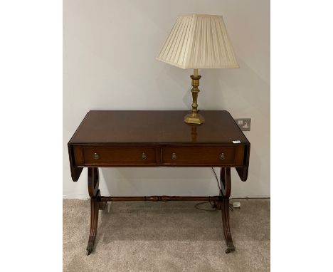 A reproduction mahogany sofa table.