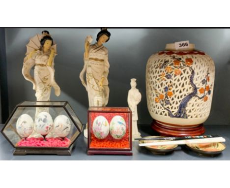 A pierced Japanese ceramic vase, H. 28cm, together with a pair of Japanese composition figures, two cases of hand painted egg