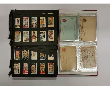 An album of post cards from South Africa, c 1890s, with a quantity of old foreign currency and an album of cigarette cards.