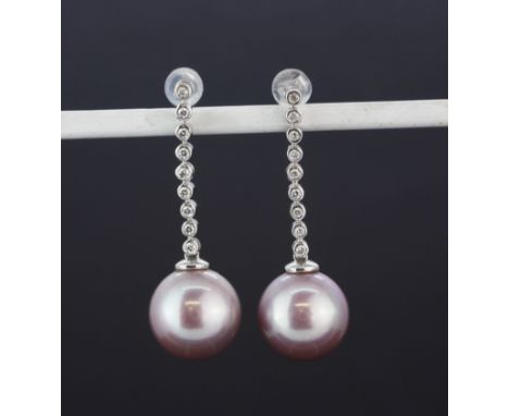 An 18ct white gold drop earrings each set with a large pink pearl and brilliant cut diamonds, L. 3.5cm.