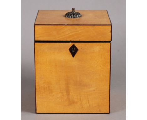AN EARLY 19th CENTURY SYCAMORE TEA CADDY of plain rectangular form, with ebonised stringing &amp; kite-shaped escutcheon, the