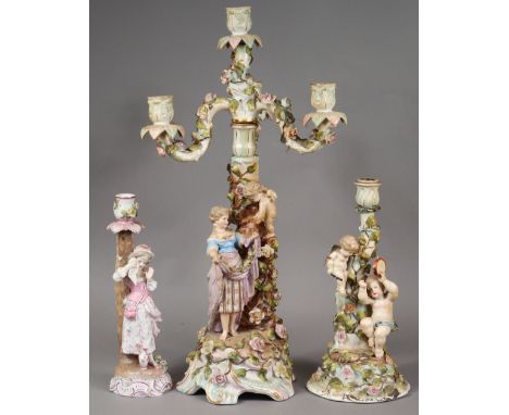 A late 19th/early 20th century Dresden porcelain candelabra with three scroll arms &amp; central sconce, the floral-encrusted