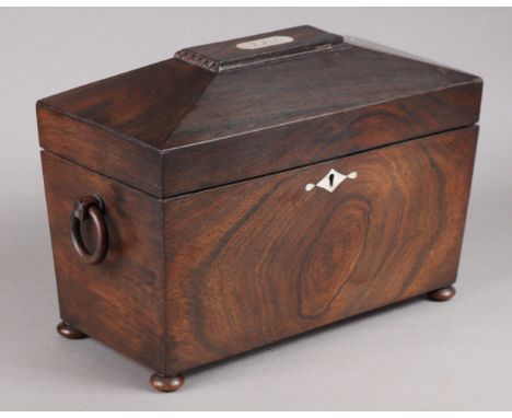 A Victorian rosewood rectangular tea caddy, of sarcophagus form, fitted two removable compartments &amp; original cut-glass l