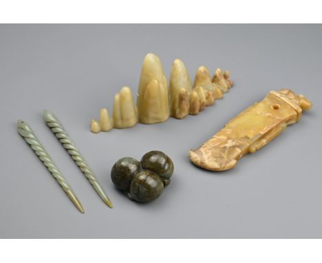 A CHINESE CARVED PALE JADE BOULDER-SHAPED BRUSH REST AND OTHER ITEMS OF JADE. The first, formed as a series of conjoined moun