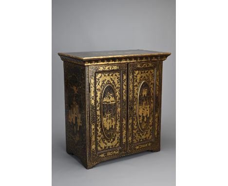 A CHINESE BLACK LACQUER AND GILT TABLE CABINET, 19TH CENTURY. With panelled doors and five drawers to the interior. Decorated