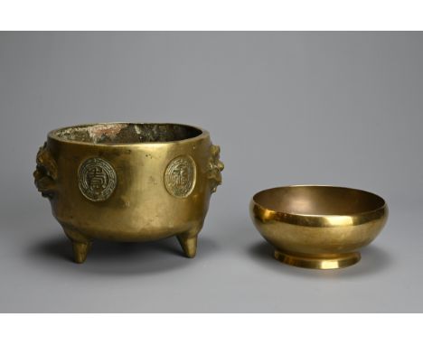 A CHINESE BRONZE TRIPOD CENSER WITH SINGING BOWL, 20TH CENTURY. The incense burner of circular form with lion mask handles wi