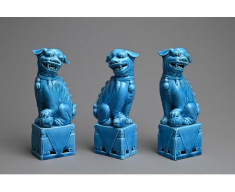 THREE VINTAGE CHINESE TURQUOISE GLAZED PORCELAIN FOO DOGS, LATE 20TH CENTURY. Two males and one female with their heads turne