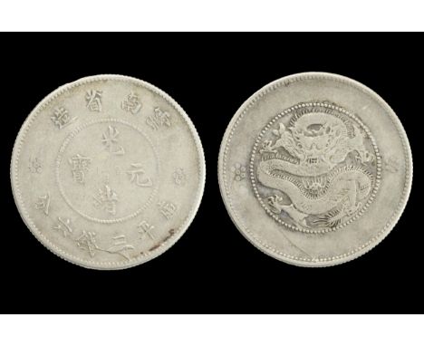 A CHINESE SILVER COIN, YUNNAN PROVINCE, XUANTONG PERIOD (1908-1912). 50 Fen. 3.4cm diam. Weight 13.3 grams. Rubbed.