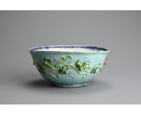 A CHINESE TURQUOISE GROUND FAMILLE ROSE QUATRE LOBED BOWL, 18/19TH CENTURY. The exterior decorated with grape vines and leave