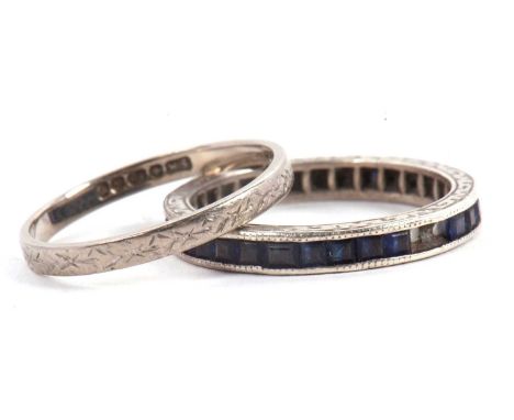 Two rings: to include a sapphire eternity ring, (possibly synthetic sapphires), all set in unmarked white metal, size O, 2.2g
