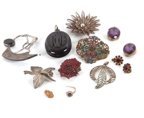 A mixed lot of jewellery: to include an abstract brooch stamped 'Jens' to reverse, silver filigree, an oval jet locket, a gar