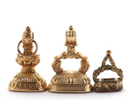 Three fobs: including an unmarked rectangular chalcedony fob with Latin inscription, 24mm wide x 36mm long, 18.3g; an unmarke