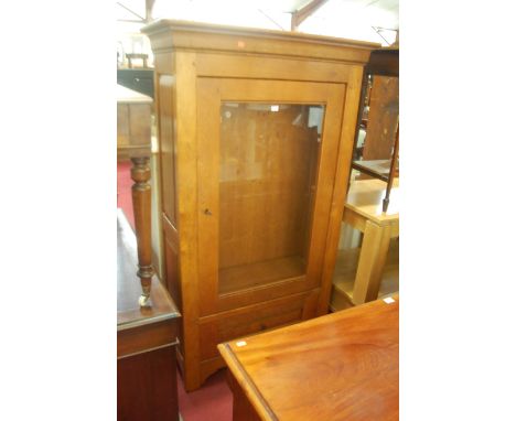 A contemporary French joined light oak single door display cabinet, having single long lower drawer, w.98cm 