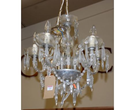 An early 20th century cut crystal glass five light hanging chandolier, having spiral turned and scroll branches, approx. drop