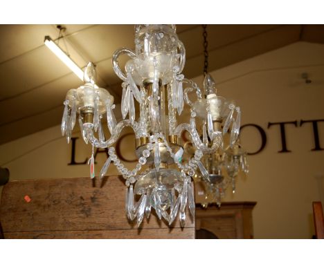An early 20th century cut crystal glass hanging four light electrolier, approx. drop 60cm