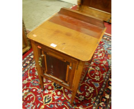 An Edwardian mahogany and satinwood inlaid ledgeback single door bedside cupboard; together with a Victorian mahogany hinge t