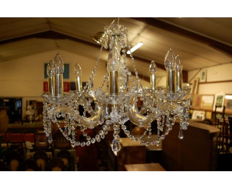 A contemporary glass eight light hanging electrolier, having clear perspex branch arms, approx. drop 60cm