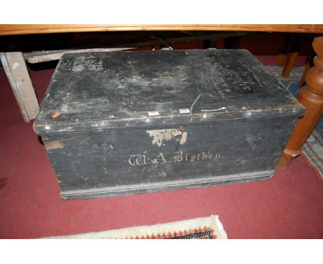 A late 19th century stained pine hinge top tool chest, with various stencilled text and iron end carry handles, width 87cm, t