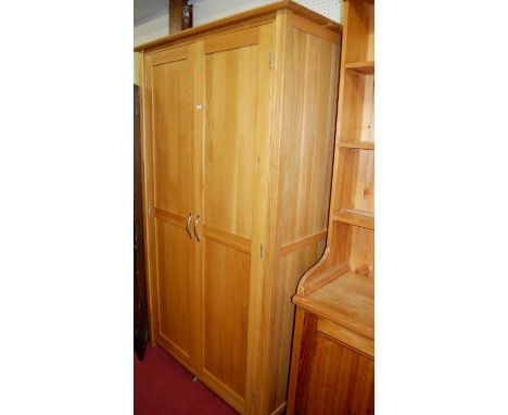 A contemporary light oak double door wardrobe, w.110cm