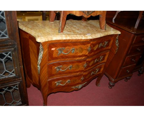 A Louis XV style walnut floral penwork decorated and gilt metal mounted serpentine bombe three drawer commode having variegat