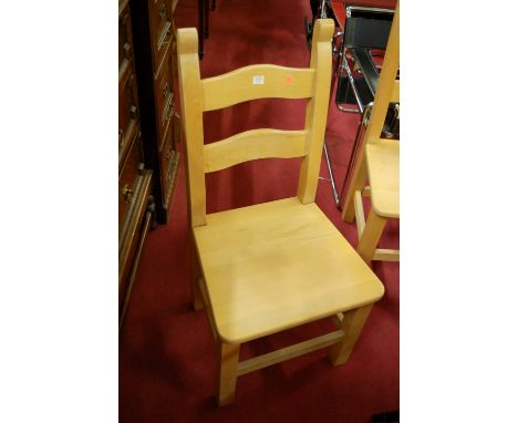 A set of four contemporary beech ladder back panelled seat kitchen chairs