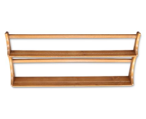 AN ERCOL LIGHT ELM HANGING PLATE RACK, labelled; together with AN ERCOL LIGHT ELM CD CABINET, of narrow proportions. (2) Cabi