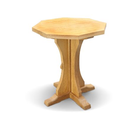 ROBERT THOMPSON OF KILBURN, A MOUSEMAN OAK COFFEE TABLE, the adzed octagonal top raised on a cruciform base, with carved mous