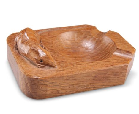 ROBERT THOMPSON OF KILBURN, A MOUSEMAN OAK ASHTRAY, of characteristic form, with carved mouse signature. 10.3cm by 7.5cmCONDI