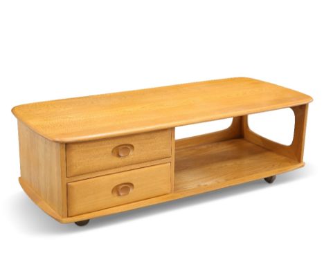 AN ERCOL 'MINERVA' LIGHT ELM TV STAND, shaped rectangular, fitted with two drawers, moving on castors. 39.5cm high, 124.5cm l