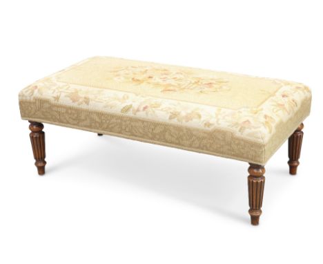 A REGENCY-STYLE NEEDLEWORK UPHOLSTERED STOOL, rectangular, with reeded tapering legs. 97.5cm longCONDITION REPORToverall good