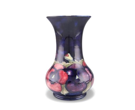 A WILLIAM MOORCROFT POTTERY VASE,&nbsp;baluster form with a long flared neck, 'Pansy' pattern, tubelined and hand-painted in 