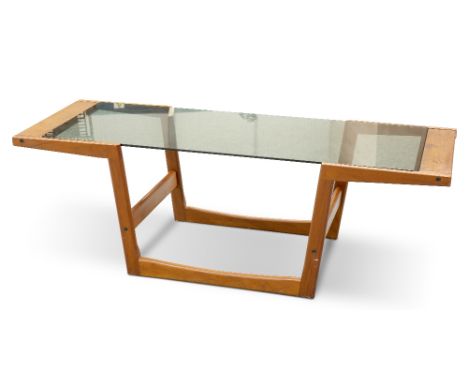 A DANISH TEAK AND SMOKED GLASS COFFEE TABLE, BY SIKA MOBLER, CIRCA 1960S, the angular U-shaped teak frame inset with smoked g