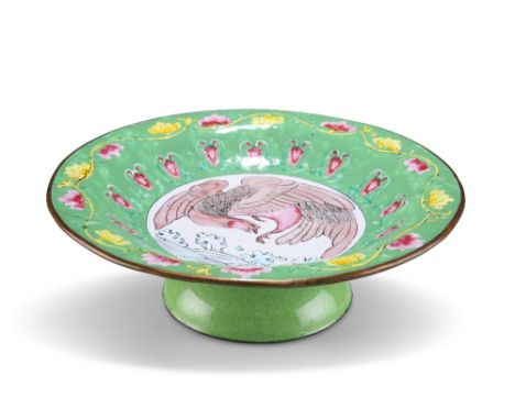 A CANTONESE GREEN-GROUND ENAMEL FOOTED DISH, the circular dish raised on a high foot, decorated to the centre with a phoenix 