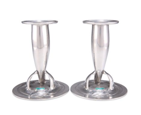 ARCHIBALD KNOX FOR LIBERTY &amp; CO, A PAIR OF TUDRIC PEWTER AND ENAMEL CANDLESTICKS, nos. 0221, each torpedo-shaped stem wit