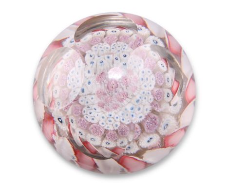 A EUROPEAN MILLEFIORI PAPERWEIGHT, POSSIBLY BY CHÊNÉE, tightly packed millefiori canes within a twisted border, in tones of p