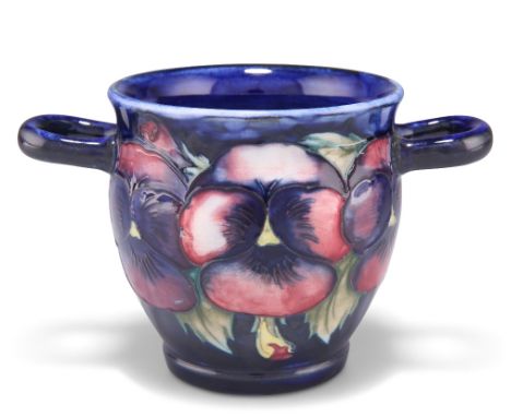 A WALTER MOORCROFT POTTERY TWIN-HANDLED JARDINIÈRE, 'Pansy' pattern, tubelined and hand-painted in tones of pink and green, t