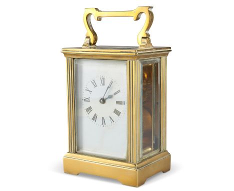 A FRENCH BRASS CASED CARRIAGE CLOCK, EARLY 20TH CENTURY, the white enamel dial with Roman numerals. 11.5cm high excl. handle,